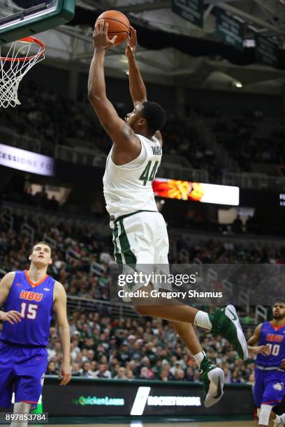 Nick Ward of the Michigan State Spartans dunks while playing the Houston Baptist Huskies at the Jack T. Breslin Student Events Center on December 18,...
