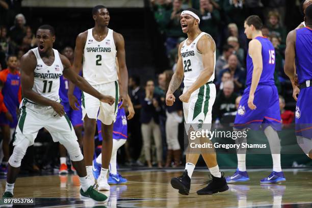 Miles Bridges and Joshua Langford of the Michigan State Spartans react to a second half play while playing the Houston Baptist Huskies at the Jack T....