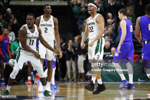 Miles Bridges and Joshua Langford of the Michigan State Spartans react to a second half play while playing the Houston Baptist Huskies at the Jack T....