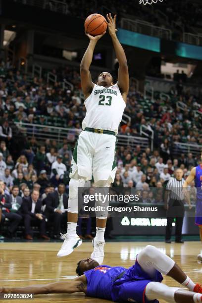 Xavier Tillman of the Michigan State Spartans takes a shot while playing the Houston Baptist Huskies at the Jack T. Breslin Student Events Center on...