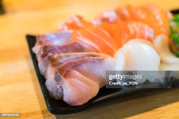 close up of shashimi japanese food, hamachi and salmon and scallop - hamachi stock pictures, royalty-free photos & images