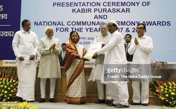 President Pratibha Patil gives away an award at the Presentation Ceremony of Kabir Puraskar and National Communal Harmony Awards also present at the...