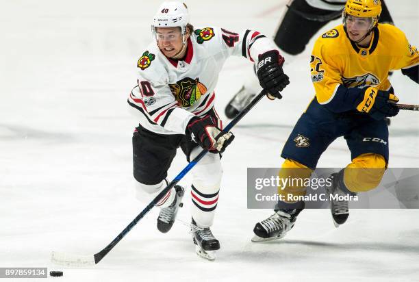 John Hayden of the Chicago Blackhawks skates against the Nashville Predators during an NHL game at Bridgestone Arena on November 28, 2017 in...