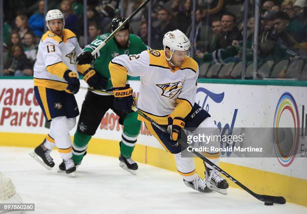 Anthony Bitetto of the Nashville Predators skates the puck against the Dallas Stars in the third period at American Airlines Center on December 23,...