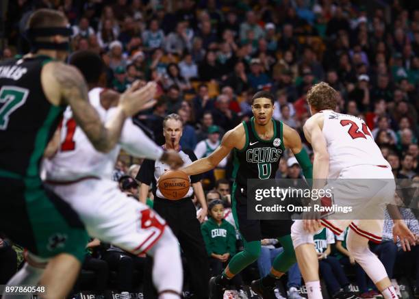 Jayson Tatum of the Boston Celtics brings the ball up court during the second half of the game against the Chicago Bulls at TD Garden on December 23,...