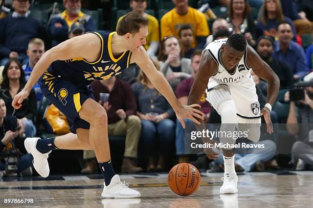 Caris LeVert of the Brooklyn Nets steals the ball from Bojan Bogdanovic of the Indiana Pacers during the second half at Bankers Life Fieldhouse on...