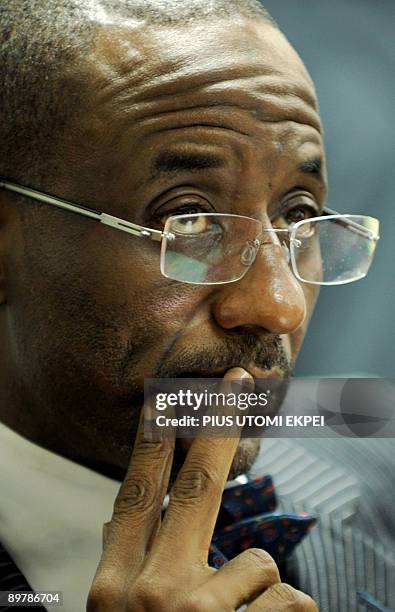 Governor of the Central Bank of Nigeria, Mallam Lamido Sanusi prepares to speak on the state of five Nigerian banks in Lagos on August 14, 2009. The...