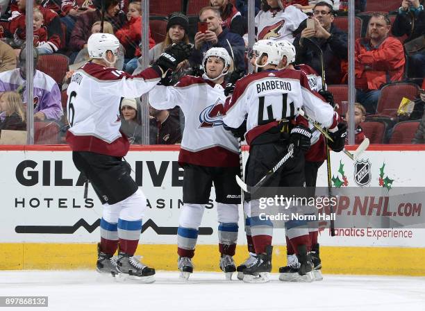 Matt Nieto of the Colorado Avalanche celebrates with Nikita Zadorov, Mark Barberio and teammates after his second period goal against the Arizona...