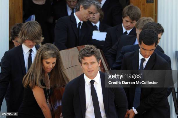 Anthony Shriver , Patrick Schwarzenegger , Maria Shriver and Bobby Shriver help to carry the coffin of Eunice Kennedy Shriver out of St. Xavier...