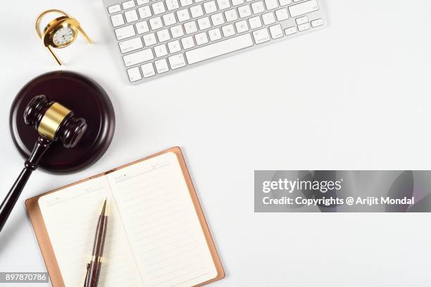 legal occupation concept directly above shot with judges gavel, computer keyboard - legal assistance stock pictures, royalty-free photos & images