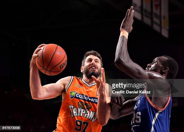 Majok Deng of the Adelaide 36ers defends Jarras Weeks of the Taipans during the round 11 NBL match between the Adelaide 36ers and the Cairns Taipans...