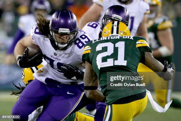 David Morgan of the Minnesota Vikings runs with the ball in front of Ha Ha Clinton-Dix of the Green Bay Packers in the third quarter at Lambeau Field...