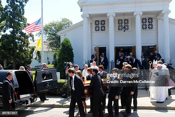 Family members carry the coffin of Eunice Kennedy Shriver to the hearse from St. Francis Xavier Church following her funeral August 14, 2009 in...