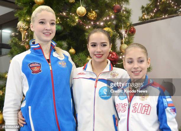 Russian figure skaters Maria Sotskova , Alina Zagitova and Alena Kostornaia pose after the Russian figure skating championships in Saint Petersburg,...