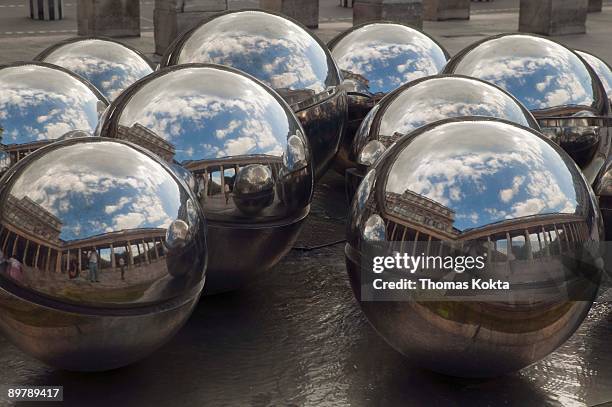 silver balls in a fountain at palais royal, paris, france - palais royal stockfoto's en -beelden