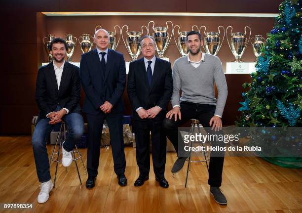 Basketball player Sergio Llull, basketball head coach Pablo Laso, president Florentino Perez and basketball player Felipe Reyes pose during a Real...