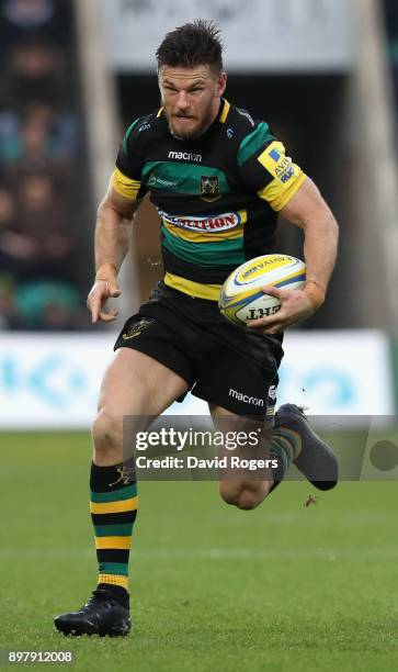 Rob Horne of Northampton runs with the ball during the Aviva Premiership match between Northampton Saints and Exeter Chiefs at Franklin's Gardens on...