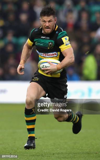 Rob Horne of Northampton runs with the ball during the Aviva Premiership match between Northampton Saints and Exeter Chiefs at Franklin's Gardens on...