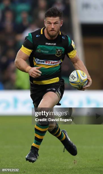 Rob Horne of Northampton runs with the ball during the Aviva Premiership match between Northampton Saints and Exeter Chiefs at Franklin's Gardens on...