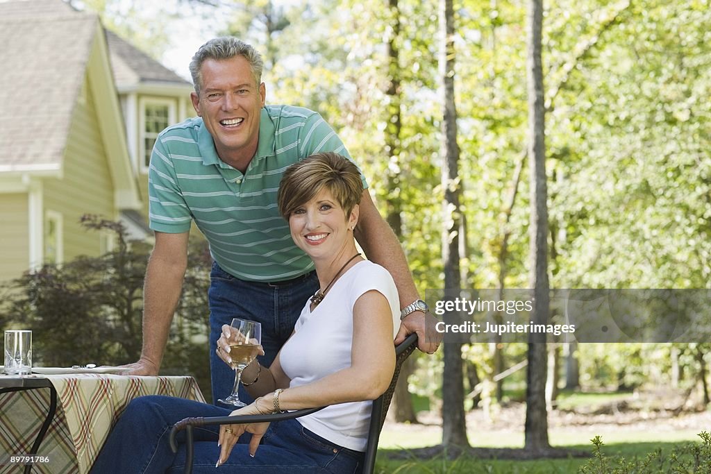 Couple with wine outdoors