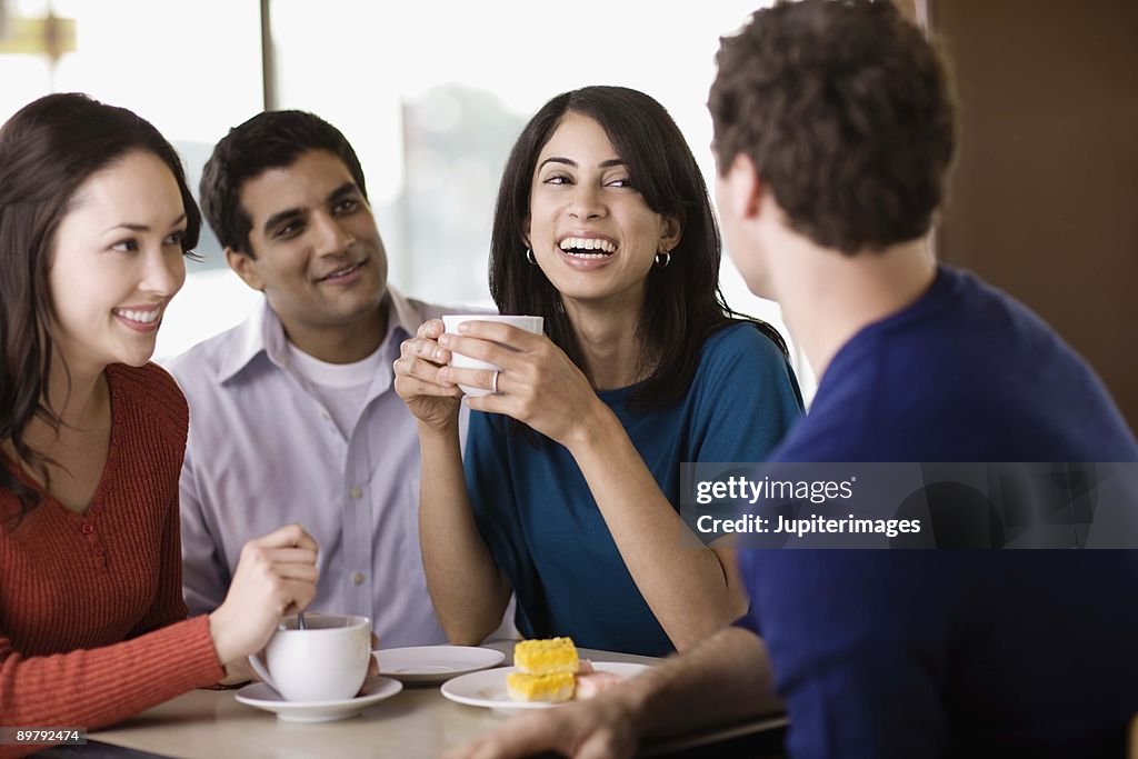 Friends talking in cafe