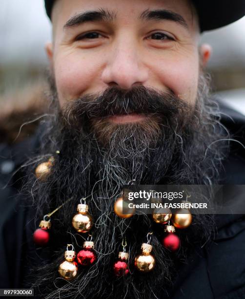 Motorcyclist Giuseppe shows his beard decorated with small Christmas balls on December 24, 2017 at a biker's meeting near Lake Hengstey in Hagen,...