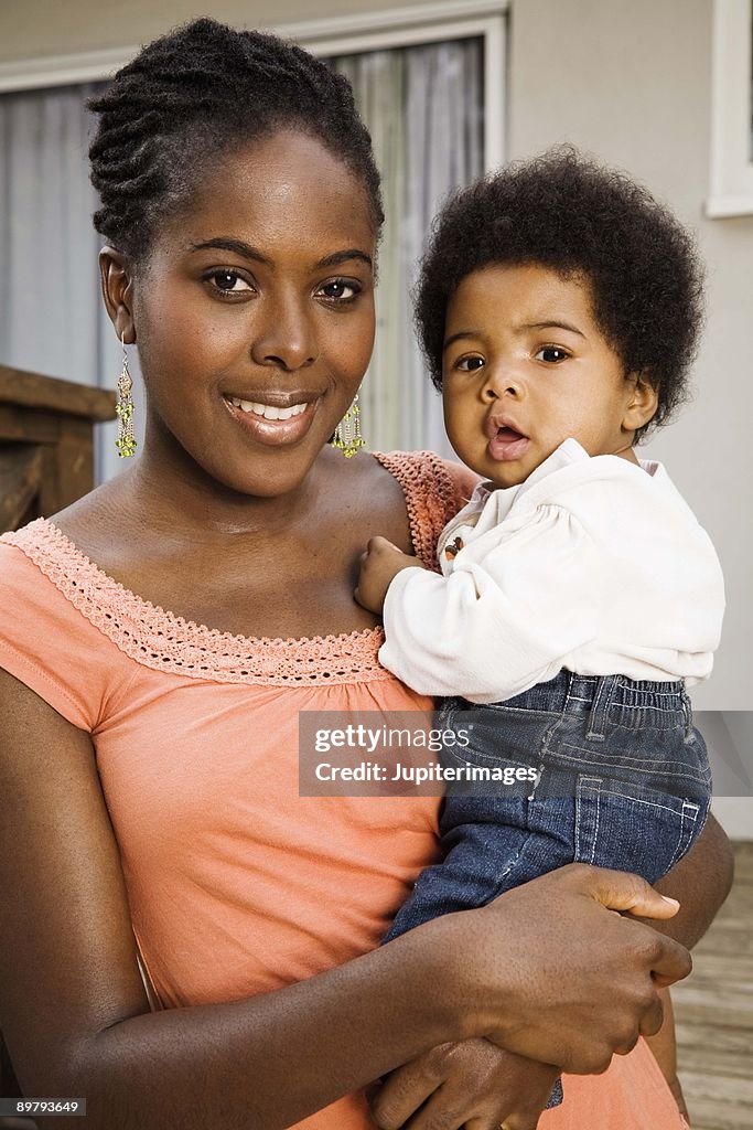 Portrait of mother with baby daughter