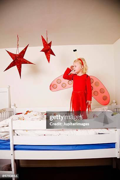 girl in fairy costume on bunk bed - bunk beds for 3 stock-fotos und bilder