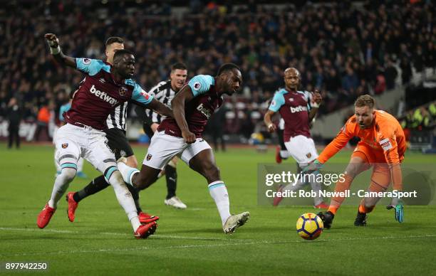 West Ham United's Michail Antonio and Cheikhou Kouyate fail to convert the penalty rebound after Andre Ayew's shot had been saved by Newcastle...