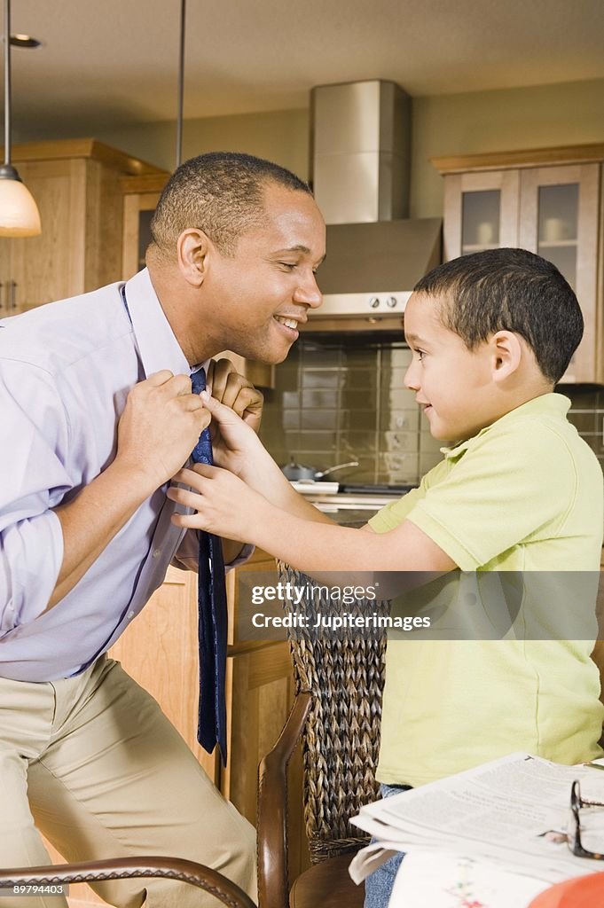 Father and son with necktie