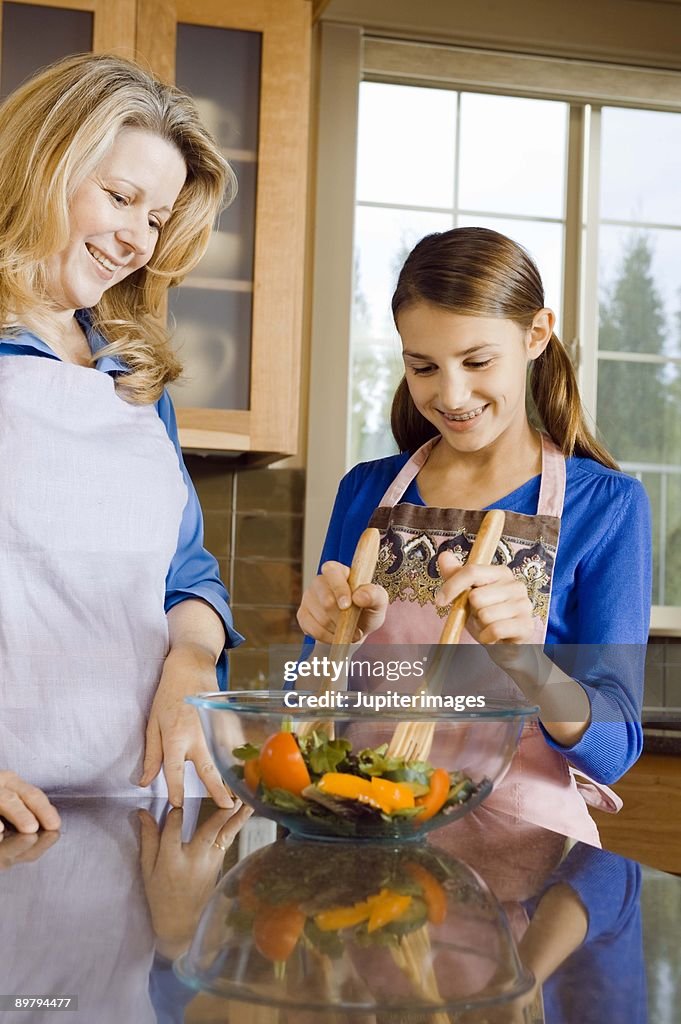 Mother and daughter cooking