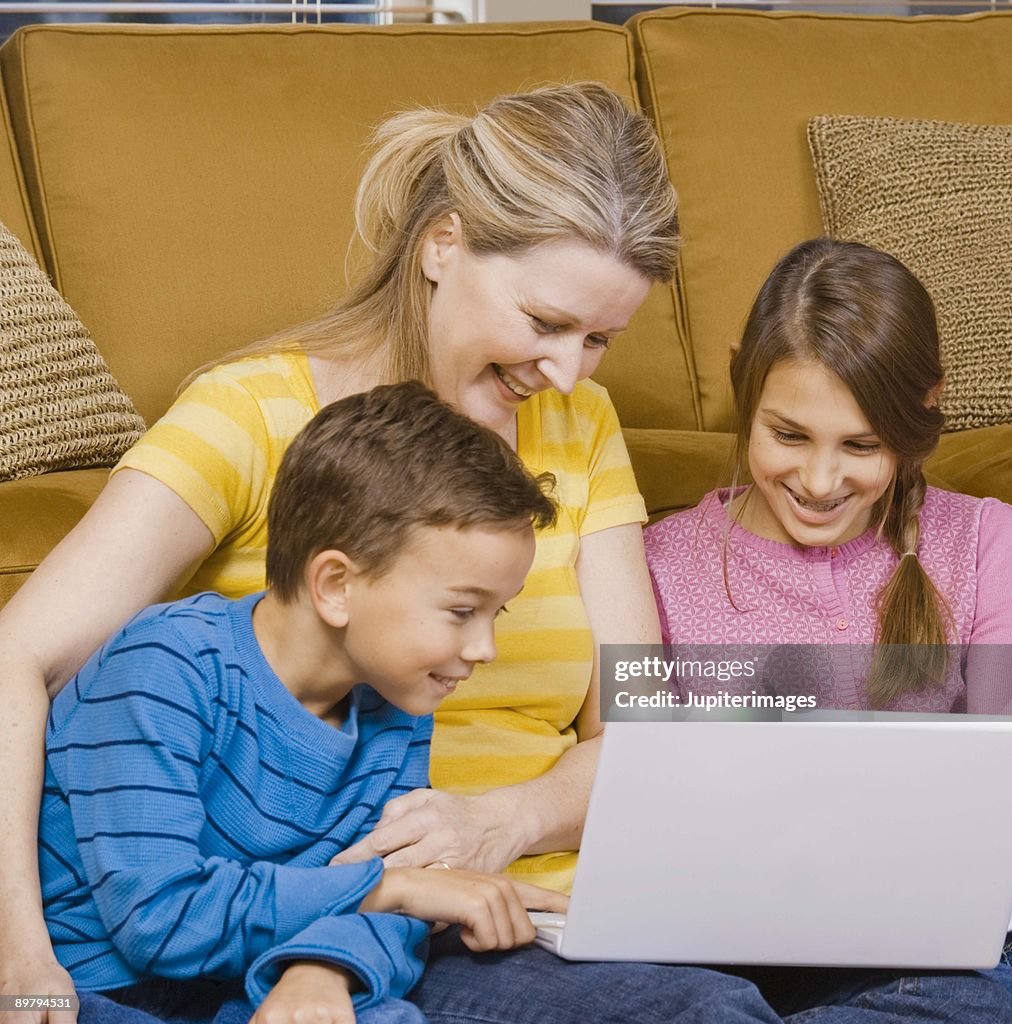Family with laptop computer