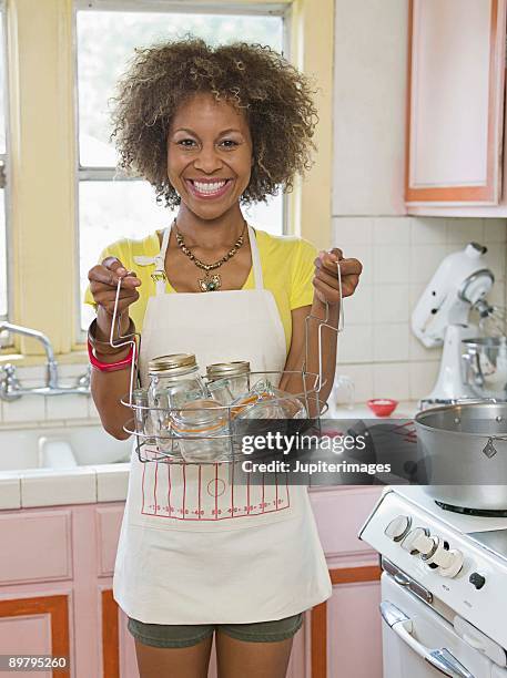 woman with jars - canning stock pictures, royalty-free photos & images