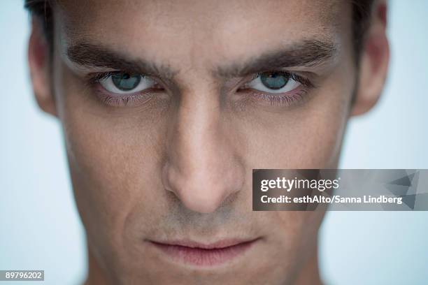 man staring at camera, close-up - determination face stock pictures, royalty-free photos & images