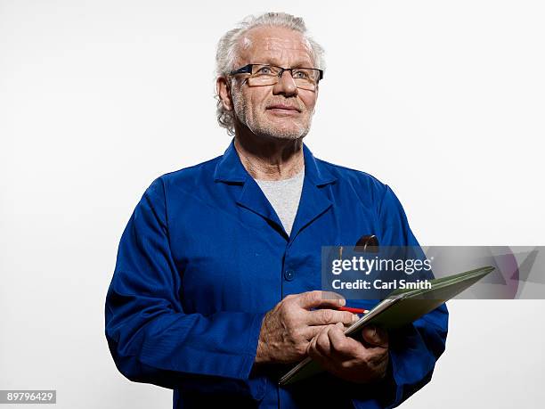 a man holding a clipboard - man with clipboard and pencil stock pictures, royalty-free photos & images
