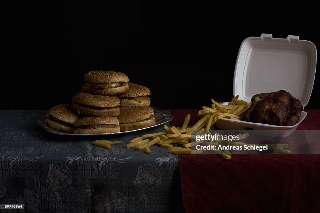 Hamburgers, French fries and roasted chicken, still life