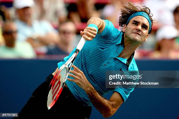 Roger Federer of Switzerland serves to Jo-Wilfried Tsonga of France during the quarterfinals of the Rogers Cup at Uniprix Stadium on August 14, 2009...