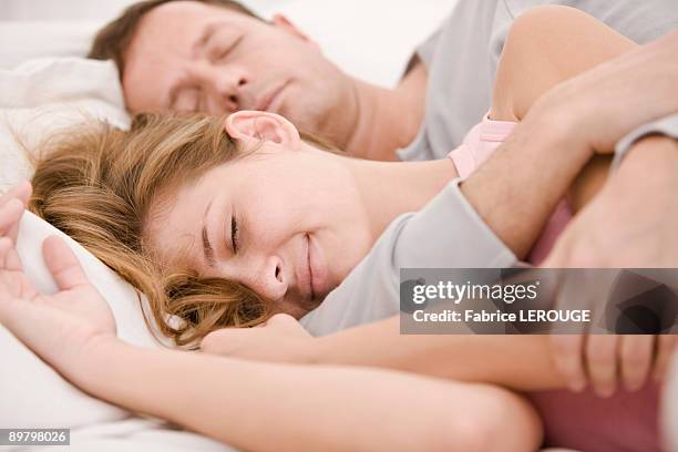 couple sleeping on the bed - hot wife stockfoto's en -beelden