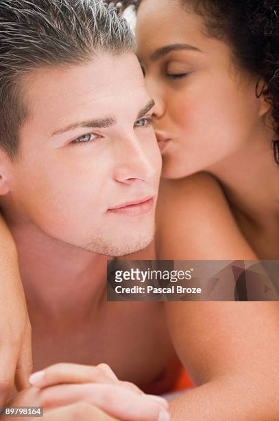 close-up of a couple romancing - chest kissing stockfoto's en -beelden