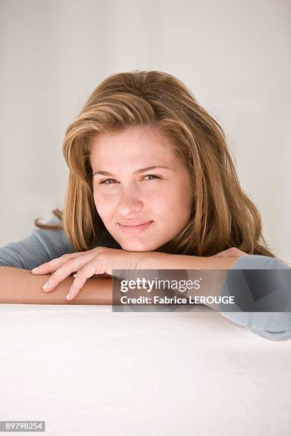 portrait of a woman thinking - leaning on elbows stock pictures, royalty-free photos & images