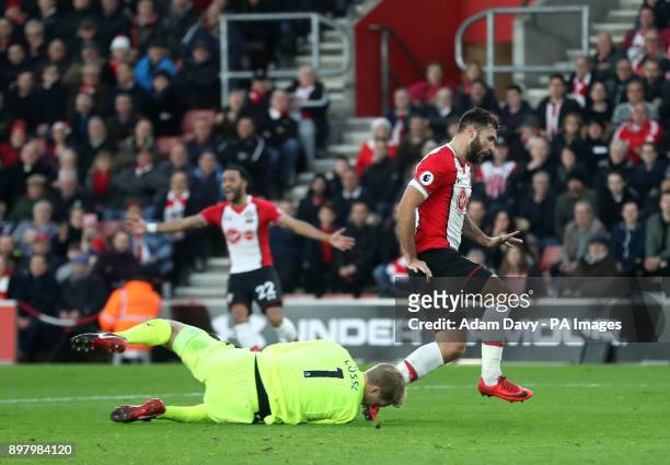 *Previously unreleased image* Huddersfield Town goalkeeper Jonas Lossl collides Southampton's Charlie Austin during the Premier League match at St...