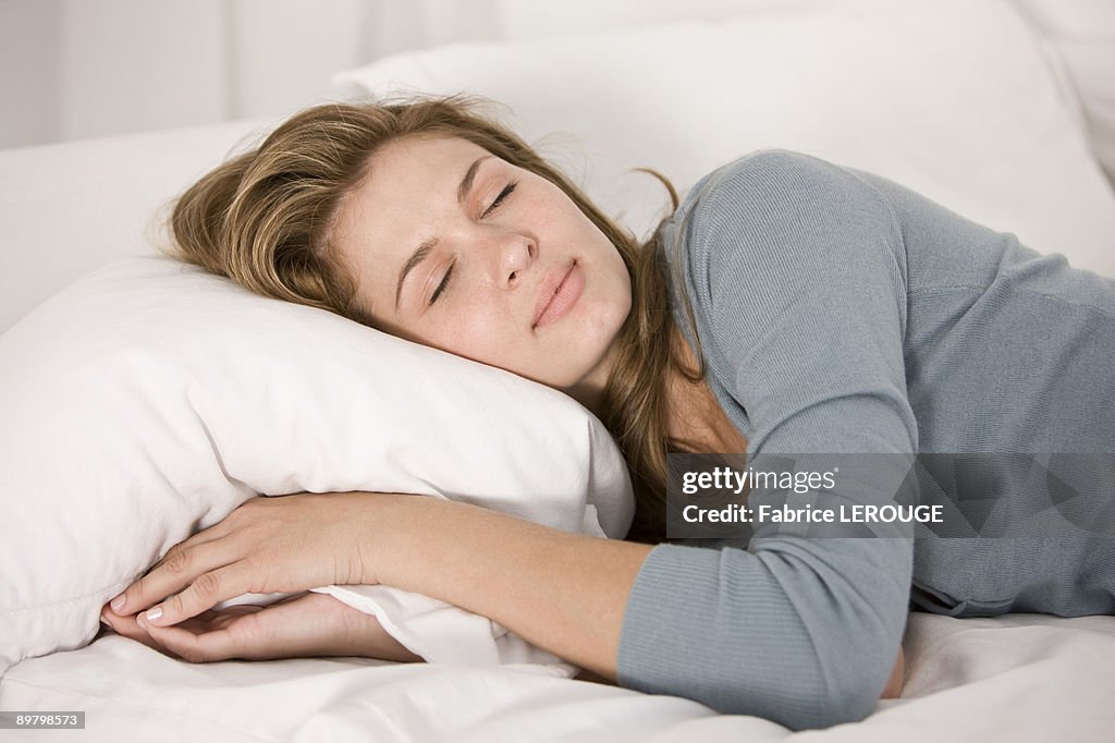 Woman sleeping on the bed