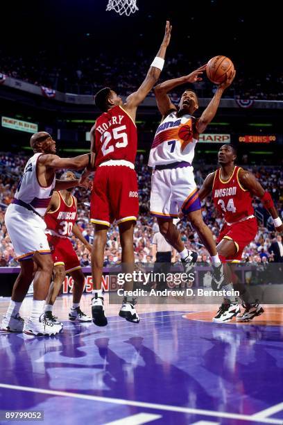 Kevin Johnson of the Phoenix Suns goes up for a shot against Robert Horry of the Houston Rockets in Game Two of the Western Conference Semifinals...