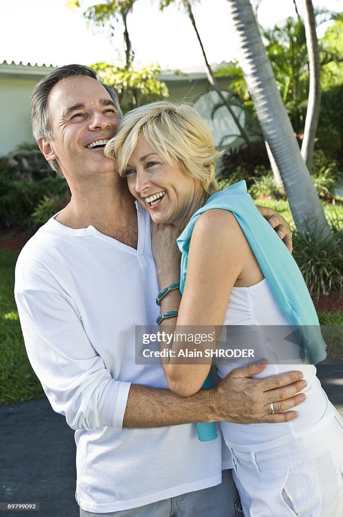 Couple embracing each other and smiling