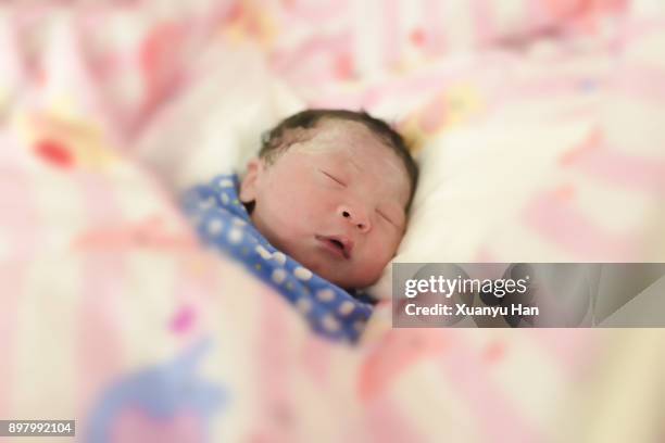 sleeping newborn baby girl. first day - its a girl kort fras bildbanksfoton och bilder