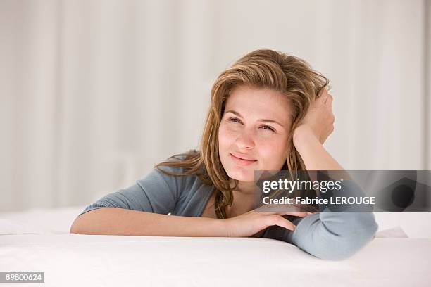 close-up of a woman thinking - leaning on elbows stock pictures, royalty-free photos & images