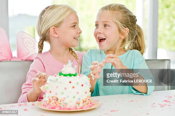 two girls enjoying a birthday party - children only braided ponytail stock pictures, royalty-free photos & images