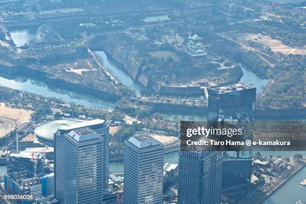 osaka city in osaka prefecture in japan daytime aerial view from airplane - japanese castle fotografías e imágenes de stock