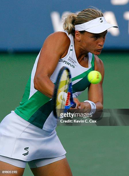 Sybille Bammer of Austria returns a shot to Jelena Jankovic of Serbia during Day 5 of the Western & Southern Financial Group Women's Open on August...