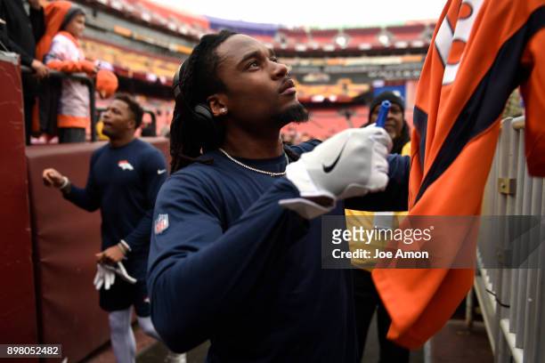 Denver Broncos free safety Bradley Roby signing autographs before taking on the Washington Redskins at FedExField in Hyattsville, MD. December 24,...